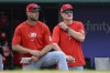 Cincinnati Reds bench coach Jeff Pickler, left, watches the Washington Nationals bat with Reds manager David Bell during the seventh inning of a baseball game against the Cincinnati Reds, Sunday, July 21, 2024, in Washington. (AP Photo/John McDonnell)