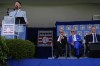 Major League Baseball Commissioner Rob Manfred, third from right, and Baseball Hall of Fame inductees Jim Leyland, second from right, and Joe Mauer, far right, look on as Baseball Hall of Fame inductee Todd Helton, at podium, speaks at the National Baseball Hall of Fame induction ceremony, Sunday, July 21, 2024, in Cooperstown, N.Y. (AP Photo/Julia Nikhinson)