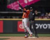 Houston Astros' Yordan Alvarez celebrates at second base after hitting a double for the cycle during the eighth inning of a baseball game against the Seattle Mariners, Sunday, July 21, 2024, in Seattle. (AP Photo/Stephen Brashear)