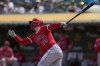 Los Angeles Angels' Brandon Drury watches his sacrifice fly that scored Willie Calhoun during the fourth inning of a baseball game against the Oakland Athletics in Oakland, Calif., Sunday, July 21, 2024. (AP Photo/Jeff Chiu)