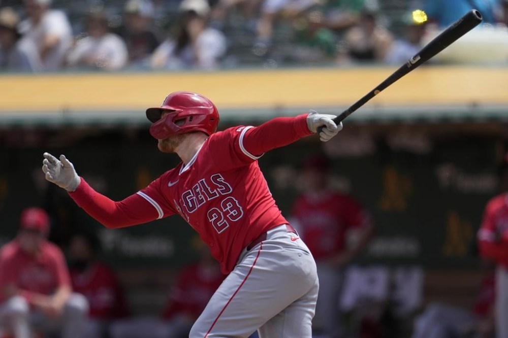 Los Angeles Angels' Brandon Drury watches his sacrifice fly that scored Willie Calhoun during the fourth inning of a baseball game against the Oakland Athletics in Oakland, Calif., Sunday, July 21, 2024. (AP Photo/Jeff Chiu)