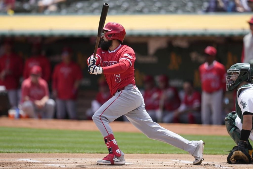 Los Angeles Angels' Anthony Rendon hits a single during the first inning of a baseball game against the Oakland Athletics in Oakland, Calif., Sunday, July 21, 2024. (AP Photo/Jeff Chiu)