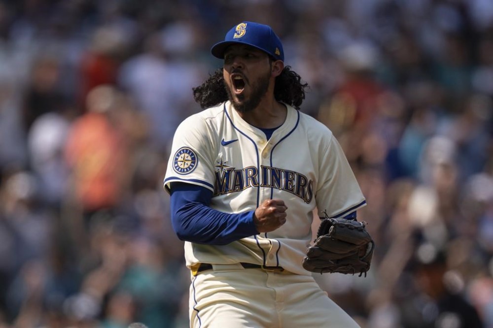 Seattle Mariners relief pitcher Andres Munoz celebrates after a a baseball game against the Houston Astros, Sunday, July 21, 2024, in Seattle. (AP Photo/Stephen Brashear)