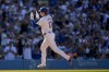 Los Angeles Dodgers designated hitter Shohei Ohtani celebrates while running the bases after hitting a solo home run during the fifth inning of a baseball game against the Boston Red Sox, Sunday, July 21, 2024, in Los Angeles. (AP Photo/Ryan Sun)