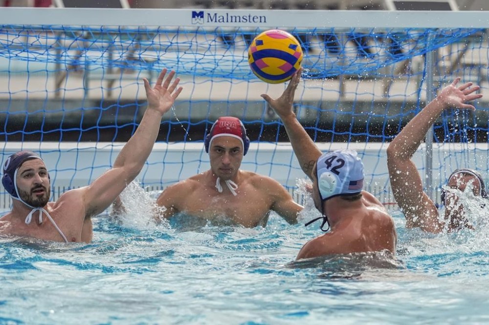U.S. Men's Olympic Water Polo team captain Ben Hallock, third from left, trains for the 2024 Paris Olympics at Mt. San Antonio College in Walnut, Calif., on Wednesday, Jan. 17, 2024. The American captain hopes to lead the U.S. men to the program's first podium finish since it won silver in 2008. (AP Photo/Damian Dovarganes)
