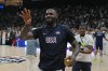 United States' LeBron James throws a signed golden ball after his team won an exhibition basketball match against Serbia at the USA Basketball Showcase, ahead of the 2024 Paris Olympic basketball tournament, in Abu Dhabi, United Arab Emirates, Wednesday, July 17, 2024. (AP Photo/Altaf Qadri)