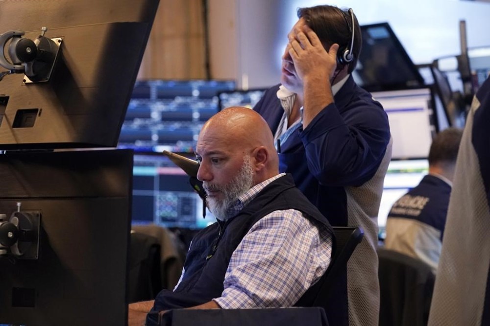 A pair of traders work on the floor of the New York Stock Exchange, Monday, July 22, 2024. U.S. stocks are climbing Monday and clawing back some of the losses from their worst week since April.(AP Photo/Richard Drew)