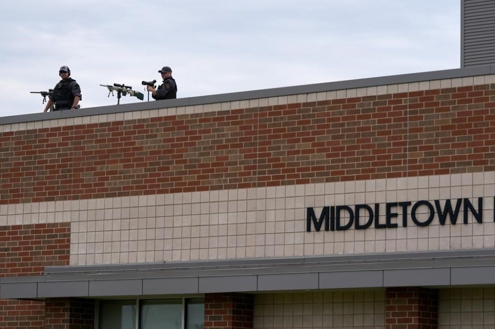 Police snipers stand atop Middletown High School before Republican vice presidential candidate Sen. JD Vance, R-Ohio, speaks at a campaign rally, Monday, July 22, 2024, in Middletown, Ohio. (AP Photo/Julia Nikhinson)