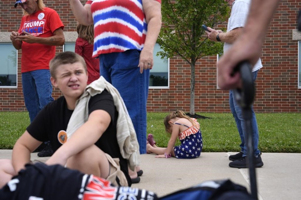 Attendees wait in line to attend a campaign rally for Republican vice presidential candidate Sen. JD Vance, R-Ohio, at Middletown High School, Monday, July 22, 2024, in Middletown, Ohio. (AP Photo/Julia Nikhinson)