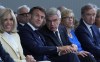 IOC President Thomas Bach, center, French President Emmanuel Macron, center left, his wife Brigitte Macron, left, and LVMH CEO Bernard Arnault, right, sit, during the IOC Session Opening Ceremony at the Louis Vuitton Foundation ahead of the 2024 Summer Olympics, Monday, July 22, 2024, in Paris, France. (AP Photo/Thibault Camus)