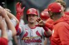 St. Louis Cardinals' Nolan Gorman celebrates in the dugout after hitting a home run during the fifth inning of a baseball game against the Pittsburgh Pirates, Monday, July 22, 2024, in Pittsburgh. (AP Photo/Matt Freed)