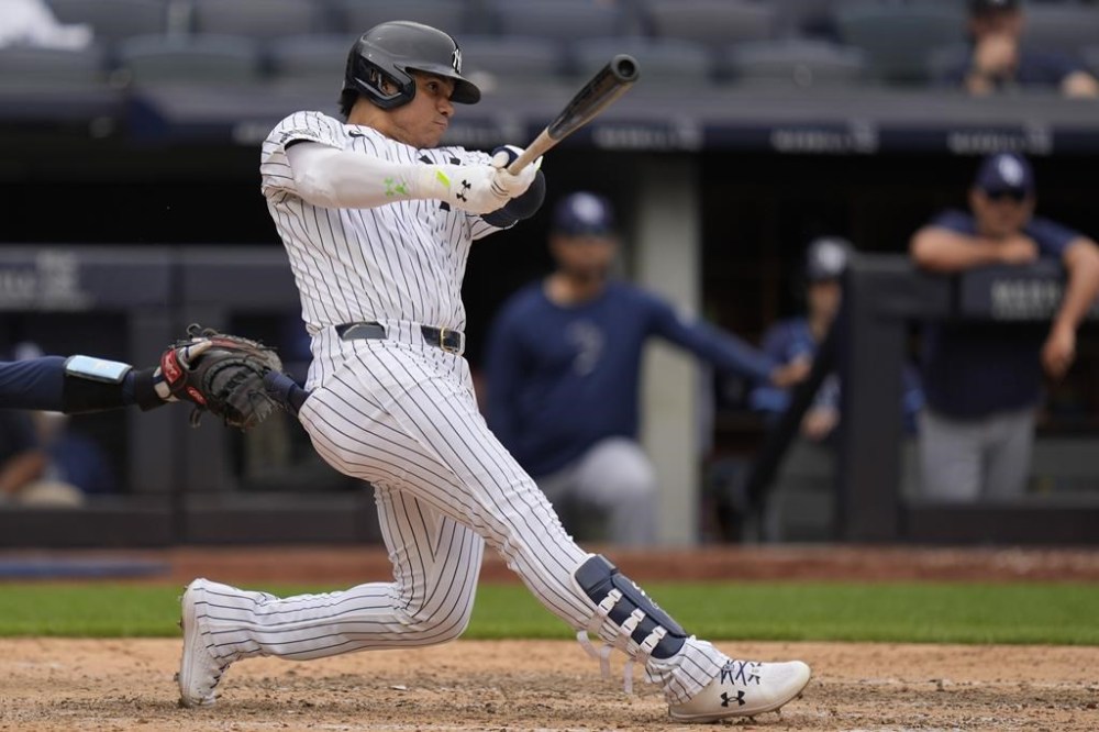 New York Yankees' Juan Soto follows through on a three-run homer during the eighth inning of a baseball game against the Tampa Bay Rays at Yankee Stadium Monday, July 22, 2024, in New York. (AP Photo/Seth Wenig)
