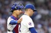 Chicago Cubs catcher Miguel Amaya talks with starting pitcher Javier Assad during the third inning of a baseball game against the Milwaukee Brewers Monday, July 22, 2024, in Chicago. (AP Photo/Charles Rex Arbogast)