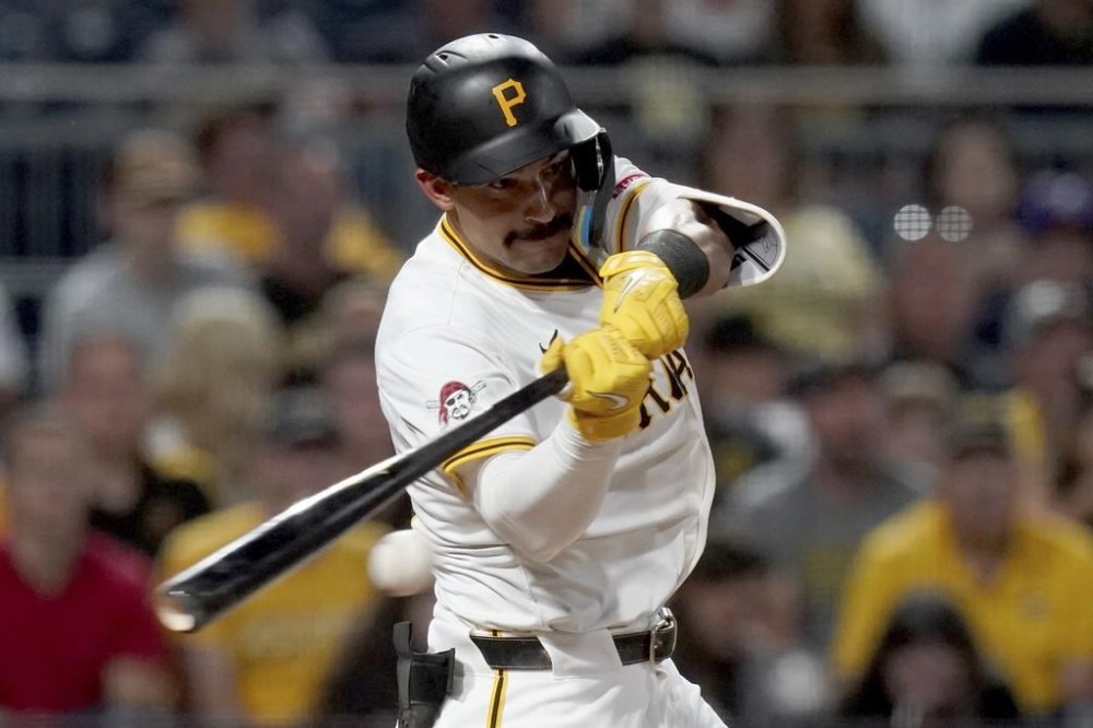 Pittsburgh Pirates' Nick Gonzales hits an RBI single during the eighth inning of a baseball game against the St. Louis Cardinals, Monday, July 22, 2024, in Pittsburgh. (AP Photo/Matt Freed)