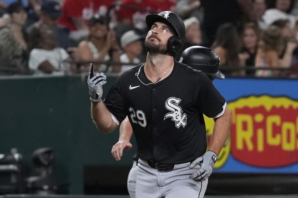 Chicago White Sox's Paul DeJong points upward while running the bases after hitting a home run during the ninth inning of a baseball game against the Texas Rangers in Arlington, Texas, Monday, July 22, 2024. (AP Photo/LM Otero)