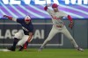 Philadelphia Phillies shortstop Trea Turner, right, forces out Minnesota Twins' Manuel Margot, left, but cannot complete a double play on a ball hit by Ryan Jeffers in the third inning of a baseball game Monday, July 22, 2024, in Minneapolis. (AP Photo/Bruce Kluckhohn)