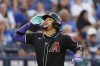 Arizona Diamondbacks' Ketel Marte reacts as he heads toward home plate after hitting a two-run home run during the third inning of a baseball game against the Kansas City Royals in Kansas City, Mo., Monday, July 22, 2024. (AP Photo/Colin E. Braley)