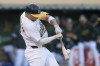 Oakland Athletics' Max Schuemann hits an RBI single against the Houston Astros during the fourth inning of a baseball game in Oakland, Calif., Monday, July 22, 2024. (AP Photo/Jeff Chiu)