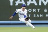 Los Angeles Dodgers left fielder Miguel Vargas catches a line drive hit by San Francisco Giants' Heliot Ramos during the first inning of a baseball game Monday, July 22, 2024, in Los Angeles. (AP Photo/Marcio Jose Sanchez)