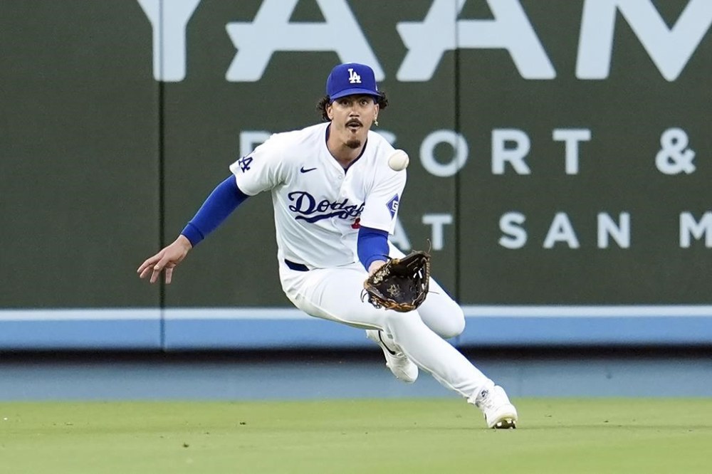 Los Angeles Dodgers left fielder Miguel Vargas catches a line drive hit by San Francisco Giants' Heliot Ramos during the first inning of a baseball game Monday, July 22, 2024, in Los Angeles. (AP Photo/Marcio Jose Sanchez)