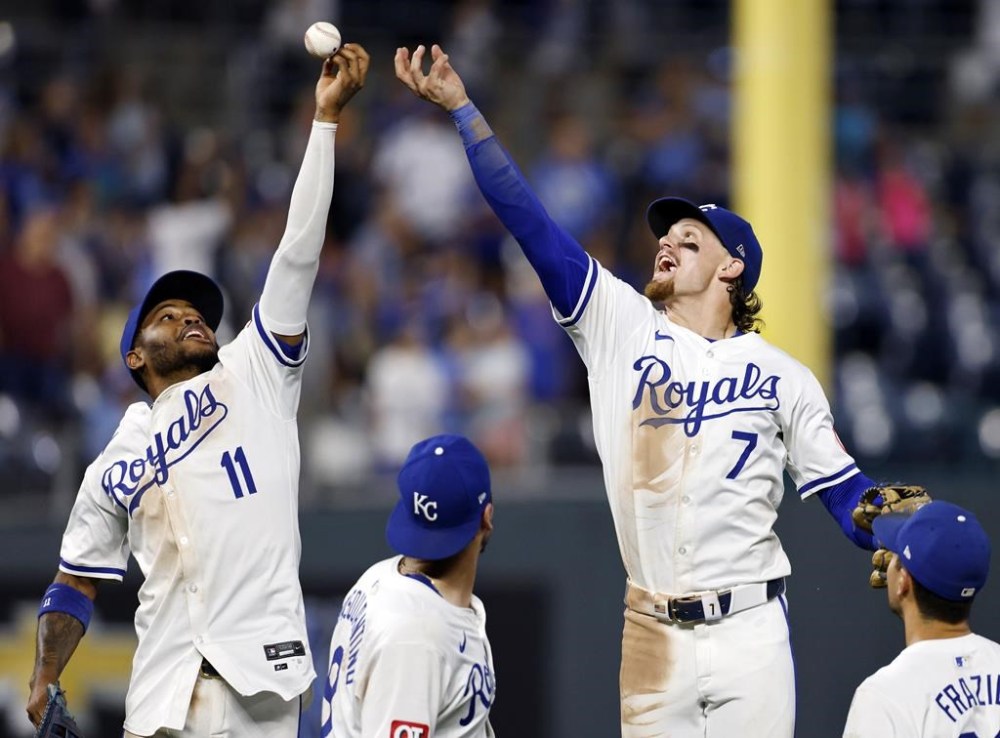 Kansas City Royals' Maikel Garcia (11) and Bobby Witt Jr. (7) celebrate with teammates after a baseball game against the Arizona Diamondbacks in Kansas City, Mo., Monday, July 22, 2024. (AP Photo/Colin E. Braley)