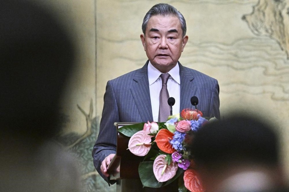 China's Foreign Minister Wang Yi speaks during an event hosting Mahmoud al-Aloul, vice chairman of Fatah, and Mussa Abu Marzuk, a senior member of Hamas, at the Diaoyutai State Guesthouse in Beijing, Tuesday, July 23, 2024. (Pedro Pardo/Pool Photo via AP)