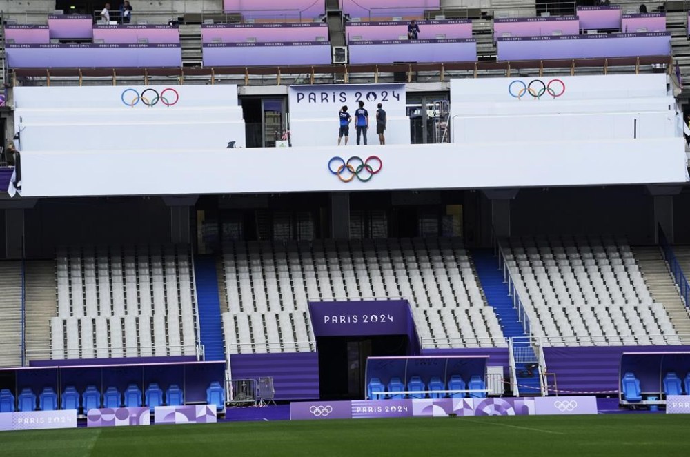 Workers are seen inside the State de France ahead of the 2024 Summer Olympics, Sunday, July 21, 2024, in Saint-Denis, France. (AP Photo/Tsvangirayi Mukwazhi)