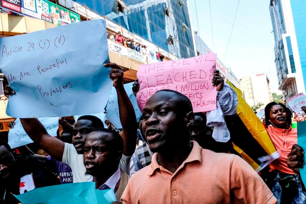 Protesters marching on the street during the anticorruption protest in Kampala, Uganda, Tuesday, July 23, 2024. Ugandan security forces on Tuesday arrested dozens of people who tried to walk to the parliament building to demonstrate against high-level corruption in protests that authorities say are unlawful. (AP Photo/Hajarah Nalwadda)