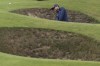 Laurie Canter of England plays from a bunker on the fifth hole during his final round of the British Open Golf Championships at Royal Troon golf club in Troon, Scotland, Sunday, July 21, 2024. (AP Photo/Scott Heppell)