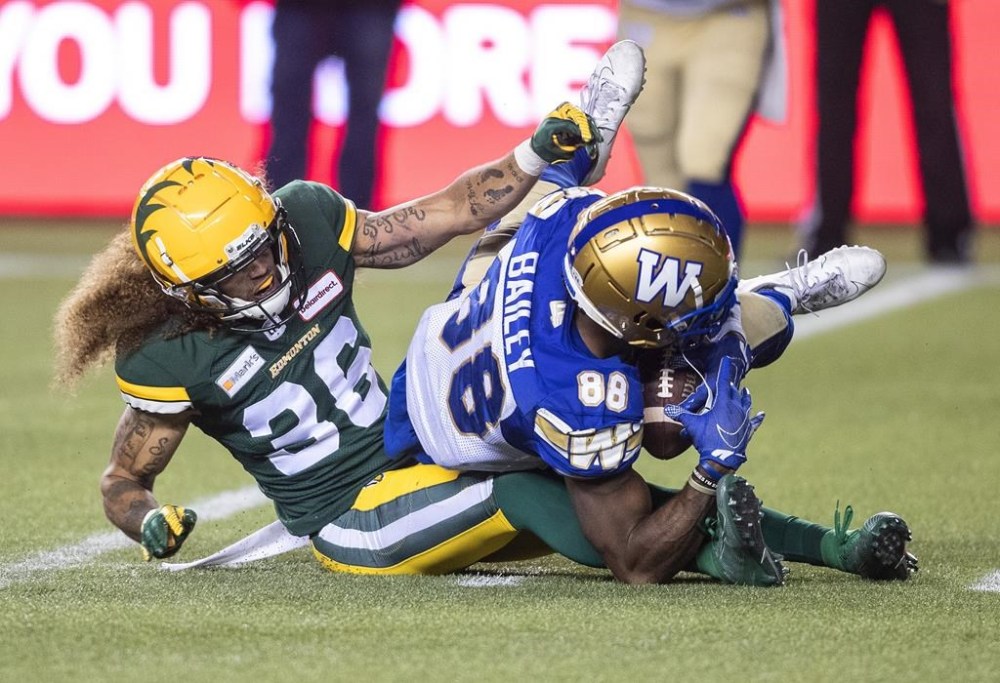 The Winnipeg Blue Bombers added veteran defensive back Aaron Grymes to the practice roster Tuesday. Winnipeg Blue Bombers' Rasheed Bailey (88) is tackled by Grymes (36), then with the Edmonton Elks, during first half CFL action in Edmonton, Alta., Saturday, Sept. 18, 2021. THE CANADIAN PRESS/Jason Franson.