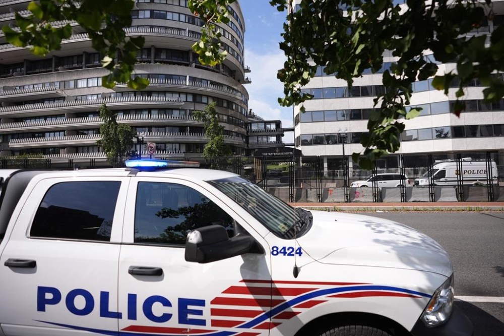Law enforcement stages near The Watergate Hotel, Tuesday, July 23, 2024, in Washington. Israeli Prime Minister Benjamin Netanyahu is in Washington this week to address Congress on Wednesday and is expected to meet with President Joe Biden on Thursday. (AP Photo/Matt Slocum)
