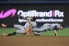 Baltimore Orioles second baseman Jorge Mateo, left, and shortstop Gunnar Henderson collide as they vie for a ball hit by Miami Marlins' Jesús Sánchez during the third inning of a baseball game, Tuesday, July 23, 2024, in Miami. Mateo was helped off the field after the play. (AP Photo/Wilfredo Lee)