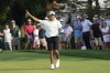 Charlie Woods signals after hitting off the 18th tee during the second round of stroke play of the U.S. Junior Amateur Golf Championship, Tuesday, July 23, 2024, in Bloomfield Township, Mich. (AP Photo/Carlos Osorio)