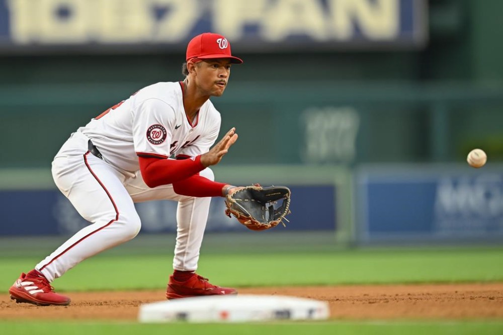 Washington Nationals third baseman Trey Lipscomb fields a ground ball from San Diego Padres' Kyle Higashioka to create a double play during the third inning of a baseball game, Tuesday, July 23, 2024, in Washington. (AP Photo/John McDonnell)