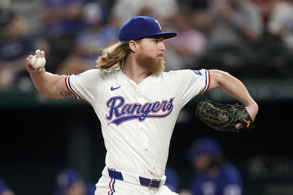 Texas Rangers starting pitcher Jon Gray throws to the Chicago White Sox in the sixth inning of a baseball game, Tuesday, July 23, 2024, in Arlington, Texas. (AP Photo/Tony Gutierrez)