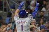 New York Mets' Jeff McNeil celebrates after hitting a home run leading to Pete Alonso scoring during the sixth inning of a baseball game against the New York Yankees, Tuesday, July 23, 2024, in New York. (AP Photo/Pamela Smith)