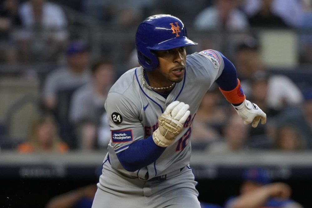 New York Mets' Francisco Lindor runs to first base after hitting a double during the third inning of a baseball game against the New York Yankees, Tuesday, July 23, 2024, in New York. (AP Photo/Pamela Smith)