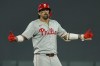 Philadelphia Phillies' Nick Castellanos celebrates his two-run double against the Minnesota Twins in the ninth inning of a baseball game, Tuesday, July 23, 2024, in Minneapolis. (AP Photo/Bruce Kluckhohn)