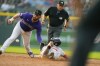 Boston Red Sox's Romy Gonzalez, right, steals second base as Colorado Rockies second baseman Brendan Rodgers, left, fields the throw and second base umpire Bruce Dreckman waits to make the call in the second inning of a baseball game Tuesday, July 23, 2024, in Denver. (AP Photo/David Zalubowski)