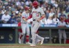 Los Angeles Angels' Logan O'Hoppe scores a run on a bases-loaded walk during the fifth inning of a baseball game against the Seattle Mariners, Tuesday, July 23, 2024, in Seattle. (AP Photo/Stephen Brashear)
