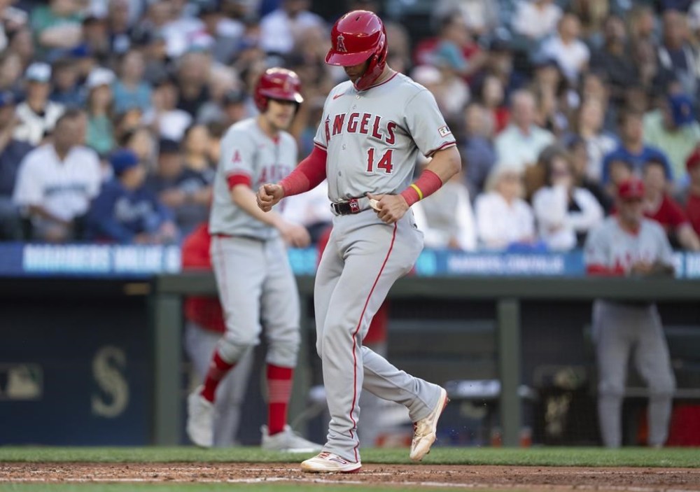 Los Angeles Angels' Logan O'Hoppe scores a run on a bases-loaded walk during the fifth inning of a baseball game against the Seattle Mariners, Tuesday, July 23, 2024, in Seattle. (AP Photo/Stephen Brashear)