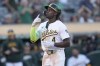 Oakland Athletics' Lawrence Butler gestures after hitting a home run against the Houston Astros during the third inning of a baseball game in Oakland, Calif., Tuesday, July 23, 2024. (AP Photo/Jeff Chiu)