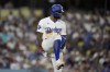 Los Angeles Dodgers' Jason Heyward breaks his bat over his leg after lining out to end the fifth inning of a baseball game against the San Francisco Giants, Tuesday, July 23, 2024, in Los Angeles. (AP Photo/Marcio Jose Sanchez)