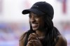 FILE - Olympic gold medalist Simone Biles Owens is interviewed after training at the Stars Gymnastics Sports Center in Katy, Texas, Monday, Feb. 5, 2024. (AP Photo/Michael Wyke, File)