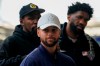 United States' Steph Curry, centre, Kevin Durant, background left, and Joel Embiid arrive at St Pancras Station with teammates, to take the Eurostar train as they make their way to the Olympic Games in Paris, in London, Wednesday, July 24, 2024.(AP Photo/Alberto Pezzali)