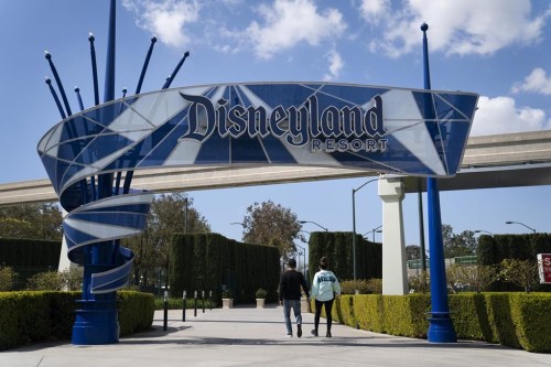FILE - The Disneyland Resort entrance is seen, March 9, 2021, in Anaheim, Calif. Disney has reached a tentative agreement with four unions representing thousands of workers at its California theme parks, including ride operators, candy makers and parking attendants. (AP Photo/Jae C. Hong, File)