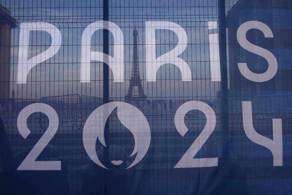 FILE - The Eiffel Tower is seen behind a Paris Olympics canvas, from the Trocadero plaza Thursday, July 18, 2024 in Paris. (AP Photo/David Goldman, File)