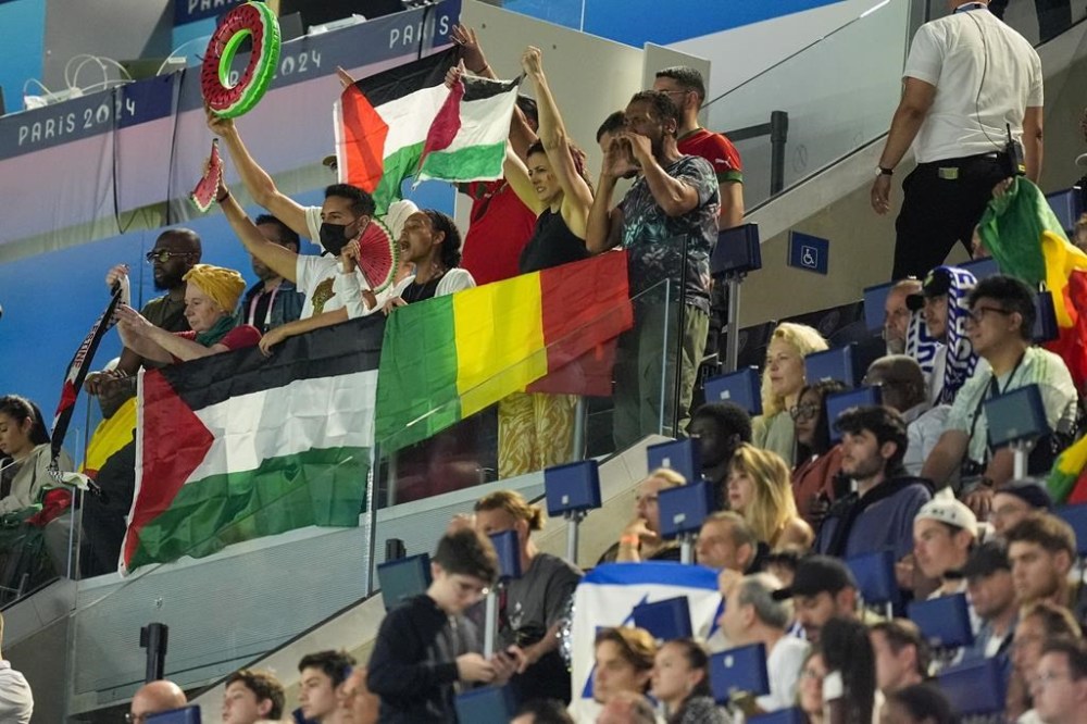 Supporters react as they watch the men's group D match between Israel and Mali at the Parc des Princes during the 2024 Summer Olympics, Wednesday, July 24, 2024, in Paris, France. (AP Photo/Rebecca Blackwell)