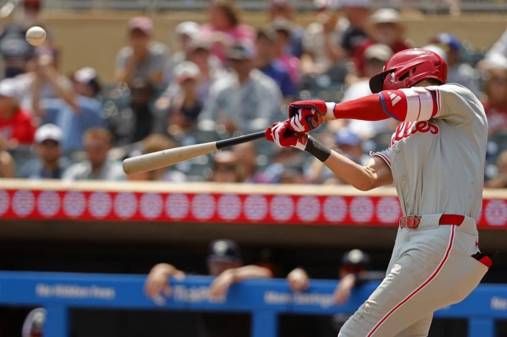Philadelphia Phillies' Trea Turner hits a solo home run against the Minnesota Twins in the fifth inning of a baseball game Wednesday, July 24, 2024, in Minneapolis. (AP Photo/Bruce Kluckhohn)