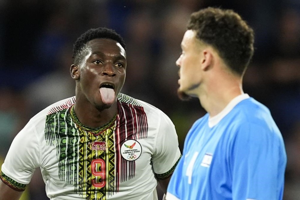 Mali's Cheickna Doumbia reacts after scoring his team's first goal during the men's group D match between Israel and Mali at the Parc des Princes during the 2024 Summer Olympics, Wednesday, July 24, 2024, in Paris, France. (AP Photo/Rebecca Blackwell)